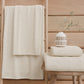 Serviettes de bain en éponge unie couleur crème