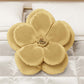 Coussin décoratif fleur or
